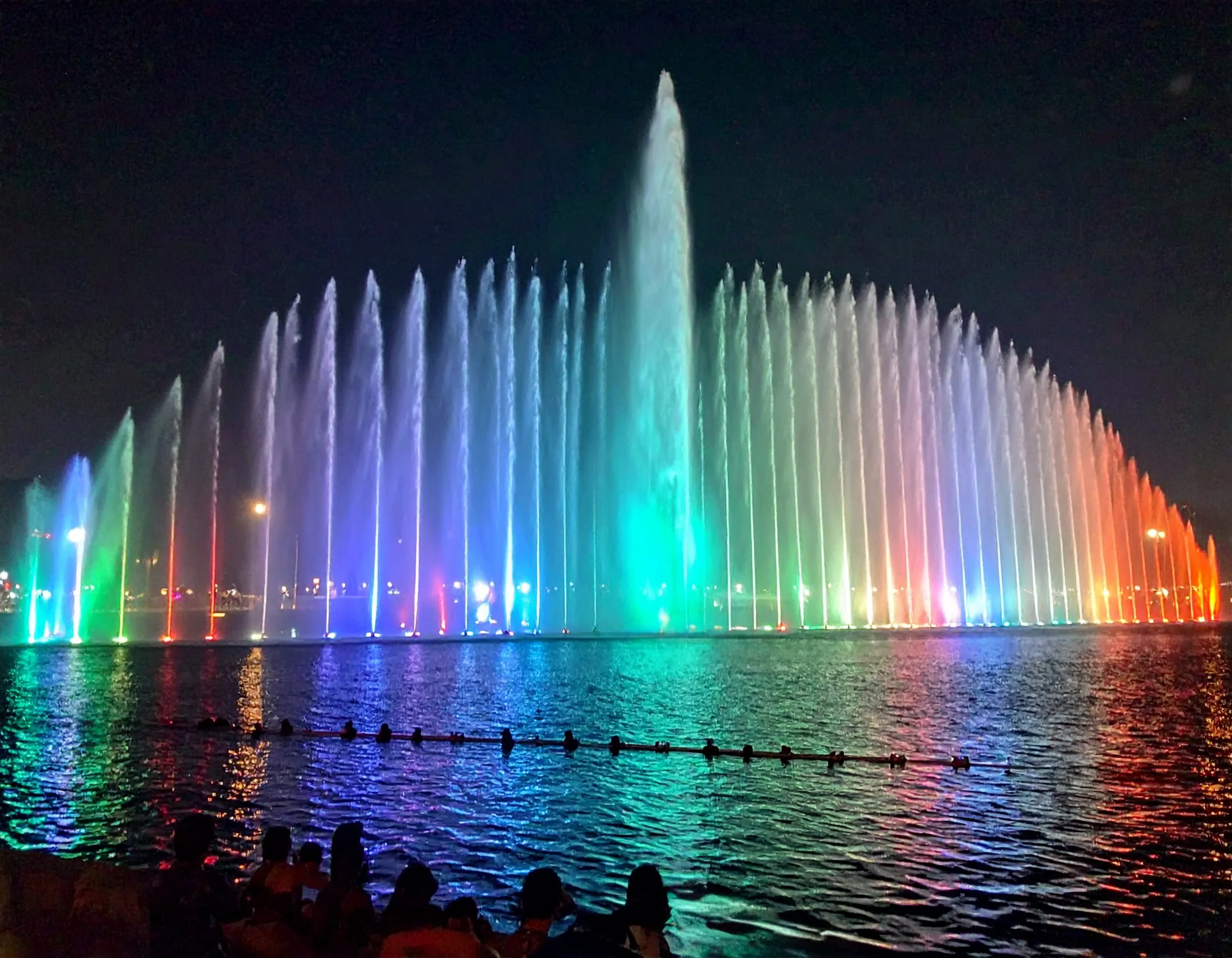 Aquatronic musical fountain show seen from the shore